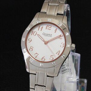 Caravelle Ladies Watch Crystal Studded Bezel Textured Dial Rose Hands 32mm